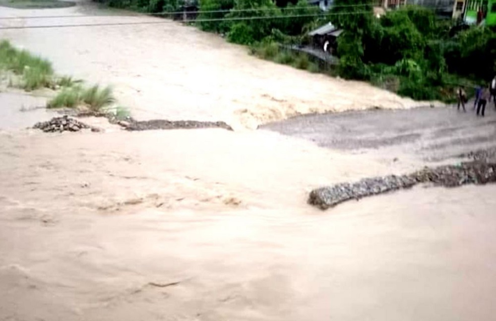 Flooded road in Dumkibas, Nawalpur after heavy rainfall disrupted traffic and washed away a diversion route.