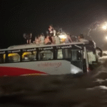 Passenger bus stranded and swept by floodwaters at Vinayi Khola diversion on East-West Highway, Nawalparasi during monsoon rains