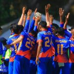 Nepal U-16 cricket team celebrating their victory after defeating Singapore by two wickets in the ACC Men’s U-16 East Zone Cup final in Kuala Lumpur, with players cheering and raising their hands.