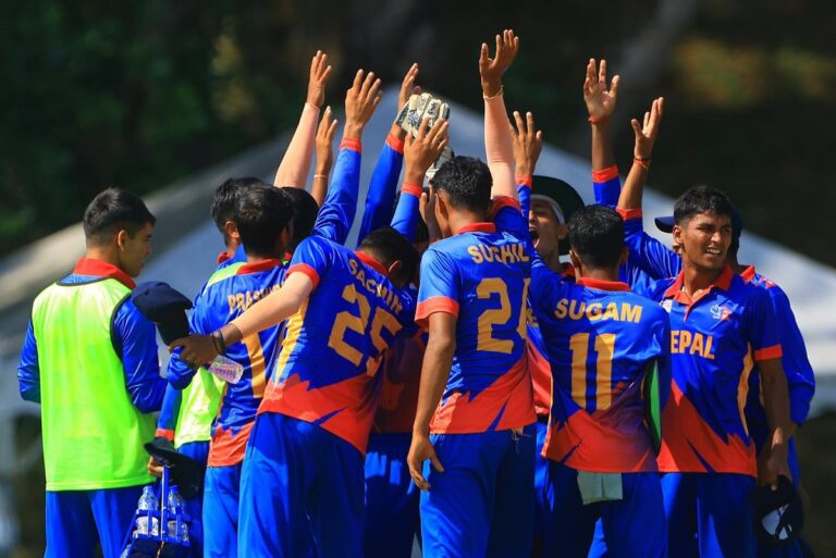 Nepal U-16 cricket team celebrating their victory after defeating Singapore by two wickets in the ACC Men’s U-16 East Zone Cup final in Kuala Lumpur, with players cheering and raising their hands.