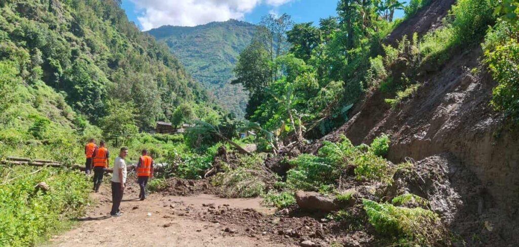 Landslide blocking East-West Highway in Nawalparasi district, Nepal, with stranded vehicles and damaged road caused by heavy rainfall and flooding.