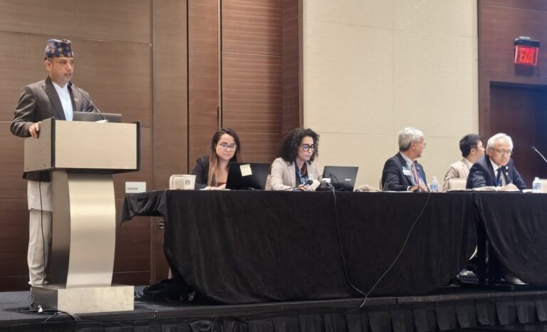 Dr. Shital Kaji Shrestha speaking at the podium during the 2025 World Veterinary Association General Assembly in Washington, D.C., representing Nepal and the SAARC Veterinary Association.