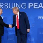 U.S. President Donald Trump greets Russian President Vladimir Putin on the red carpet at a joint military base in Anchorage, Alaska, during their three-hour summit. Both leaders described the talks as positive, with progress made on several issues.