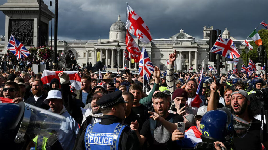 Over 100,000 people march through central London in a major anti-immigration protest as police monitor the crowd.
