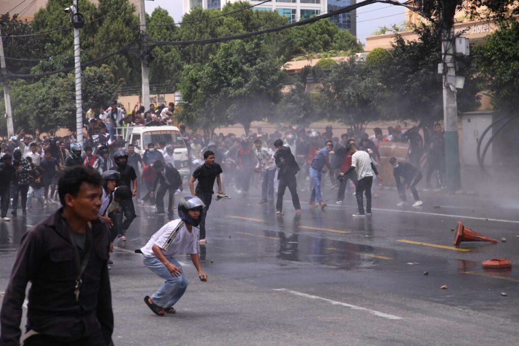 Parents of Vijay Chaudhary in Lahan waiting on the veranda, unaware their son was killed during Nepal’s Gen-Z protest in Kathmandu.