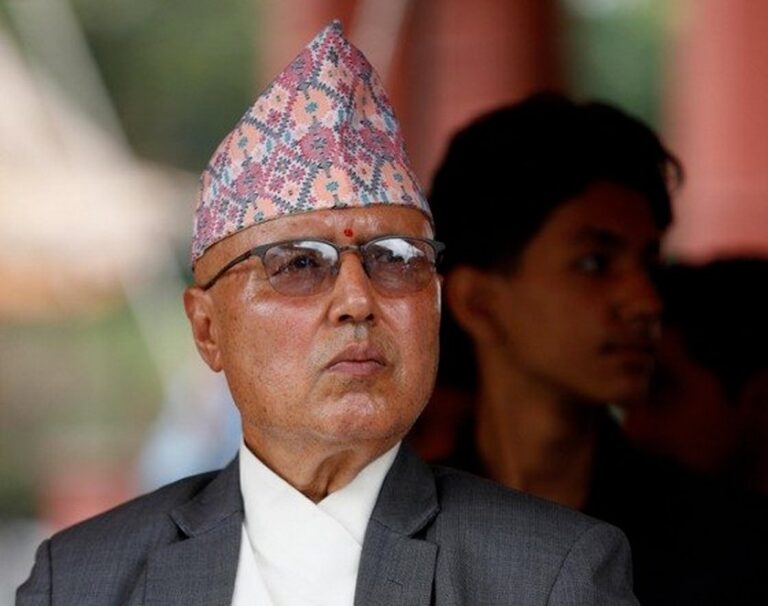 Finance Minister Rameshwar Khanal speaking to reporters at Biratnagar Airport about provinces, currency ban, and GST issues.