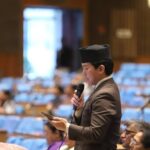 CPN-UML lawmaker Suhang Nembang speaking at the House of Representatives in Kathmandu, urging suspension of embossed number plate implementation in Nepal.
