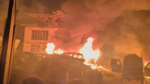 Police officers inspect the Naugam police post in Srinagar after a deadly explosion during the examination of seized explosives.