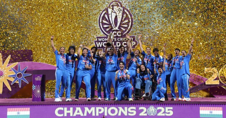 Indian women’s cricket team celebrates with the ICC Women’s ODI World Cup trophy after defeating South Africa by 52 runs in the 2025 final at DY Patil Sports Academy, Mumbai.