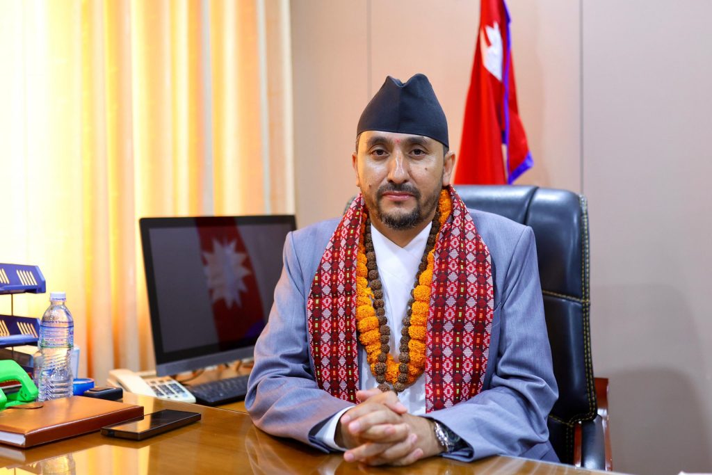Communication Minister Jagadish Kharel speaking at an interaction program with the Nepali community in Seoul, South Korea
