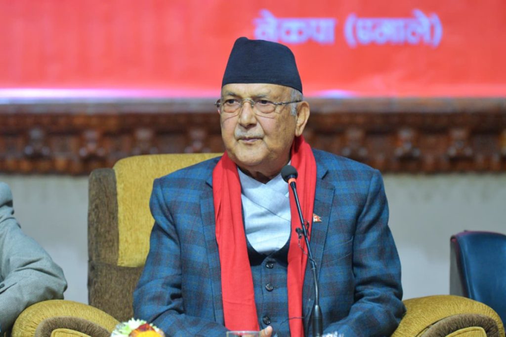 CPN–UML Chair KP Sharma Oli speaking at a party event addressing internal political tensions with Prachanda