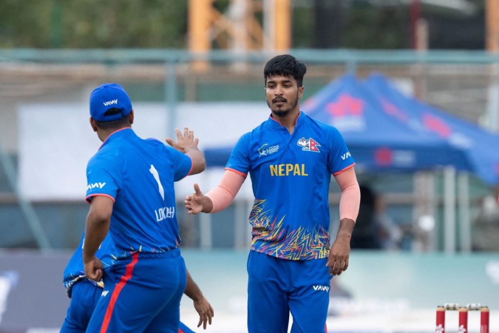 Nepal cricket players celebrate after defeating India by 92 runs in the Hong Kong Sixes Bowl League.
